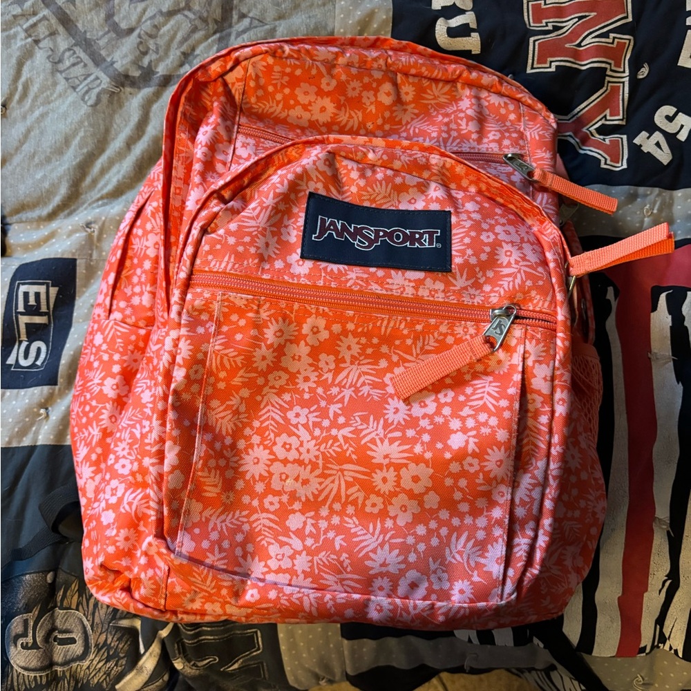 JanSport Vibrant Orange Backpack with Floral Design